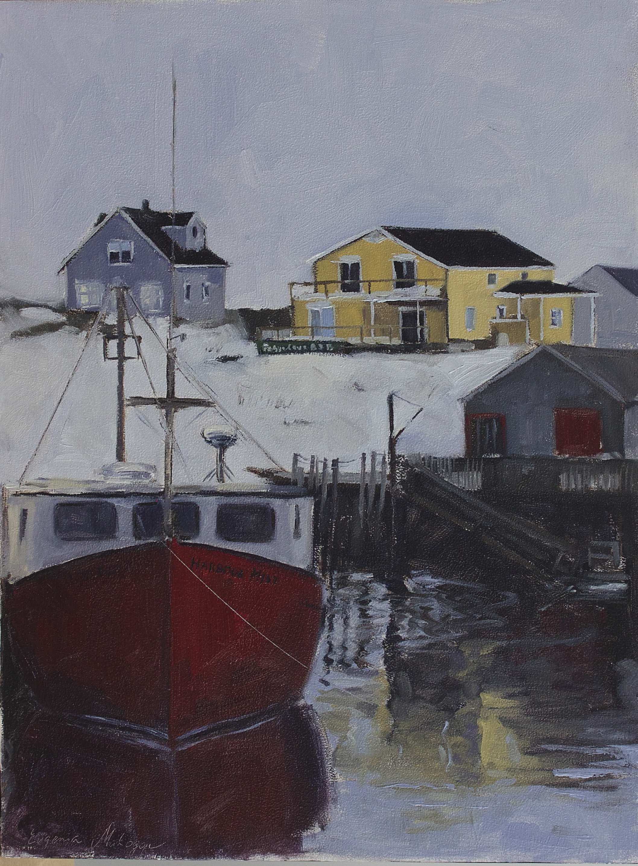 red boat in Peggy's cove harbour in a winter